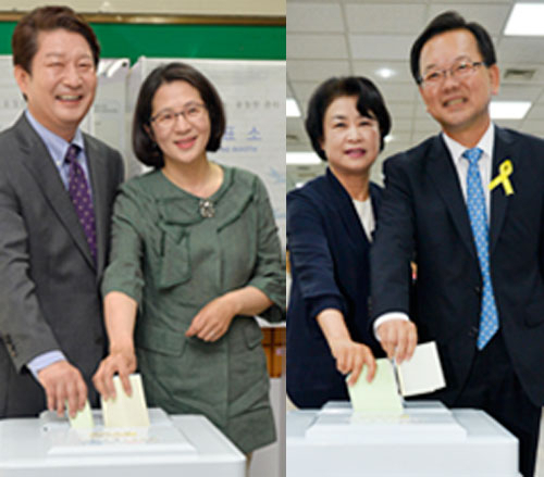 4일 오전 대구시장 선거에 출마한 권영진 새누리당 후보가 수성구 범물1동 제3투표소가 마련된 범일중학교에서 부인 이정원 씨와 함께 투표를 하고 있다.(사진 왼쪽) 성일권 기자 sungig@msnet.co.kr 4일 새정치민주연합 김부겸 대구시장 후보와 부인 이유미 씨가 수성구 만촌1동 투표소에서 투표하고 있다. 우태욱 기자 woo@msent.co.kr