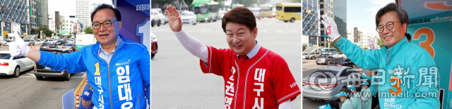 6.13 지방선거 공식 선거운동 처날인 31일 오전 대구시장 후보들이 달구벌대로 반월당 네거리와 범어네거리에서 출근길 유권자들에게 인사하며 지지를 호소하고 있다. 왼쪽부터 임대윤, 권영진, 김형기 후보. 성일권 기자 sungig@msnet.co.kr