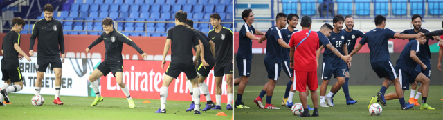 한국 축구 국가대표팀(사진 왼쪽)과 필리핀 축구 대표팀이 2019 AFC 아시안컵 UAE 조별 라운드 C조 1차전을 하루 앞둔 6일 (현지시간) 아랍에미리트 두바이 알 막툼 스타디움에서 몸을 풀고 있다. 연합뉴스