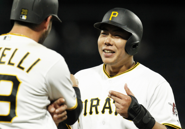 Apr 3, 2019; Pittsburgh, PA, USA; Pittsburgh Pirates catcher Francisco Cervelli (29) and shortstop Jung Ho Kang (right) joke around during a St. Louis Cardinals pitching change during the tenth inning at PNC Park. St. Louis won 5-4 in ten innings. Mandatory Credit: Charles LeClaire-USA TODAY Sports