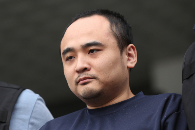 모텔 손님을 살해한 뒤 시신을 훼손해 한강에 유기한 혐의로 구속된 장대호(38). 연합뉴스