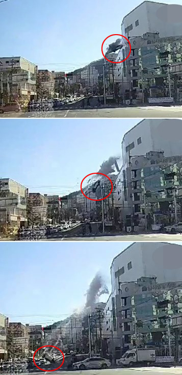 30일 낮 12시 30분께 부산 연제구 한 대형마트 5층 주차장에서 차량이 벽을 뚫고 도로 아래로 추락하고 있다. 연합뉴스
