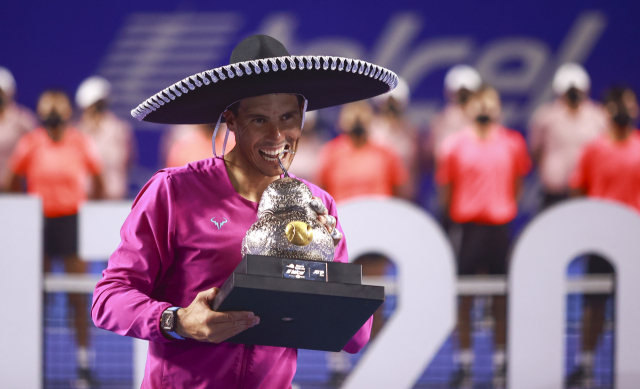 epa09788375 Rafael Nadal of Spain celebrates after winning the singles final match of the Mexican Open tennis tournament, in Acapulco, Mexico, 26 February 2022. EPA/David Guzman