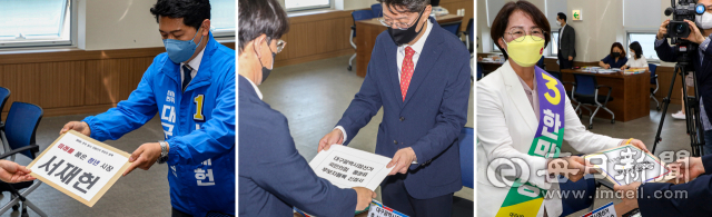 6월 1일 치러지는 제8회 전국동시지방선거 후보자 등록 첫날인 지난 12일 대구선거관리위원회에서 대구시장에 출마한 더불어민주당 서재헌 후보(왼쪽부터), 국민의힘 홍준표 후보 대리인, 정의당 한민정 후보가 등록을 하고 있다. 안성완 기자 asw0727@imaeil.com
