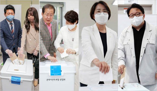6·1 지방선거 사전투표 첫날인 27일 오전 대구 달서구 이곡2동 행정복지센터에서 더불어민주당 서재헌 대구시장 후보가 부인과 함께 사전투표를 하고 있다. 안성완 기자(사진 맨 왼쪽)/ 대구 수성구 두산동 행정복지센터에 마련된 투표소에서 국민의힘 홍준표 대구시장 후보와 부인 이순삼씨가 투표하고 있다. 연합뉴스/ 정의당 한민정 대구시장 후보가 27일 대구 달서구 도원동 행정복지센터에서 사전투표를 하고 있다. 연합뉴스/ 대구 중구 삼덕동 행정복지센터에 마련된 투표소에서 기본소득당 신원호 대구시장 후보가 투표하고 있다. 신원호 후보 제공