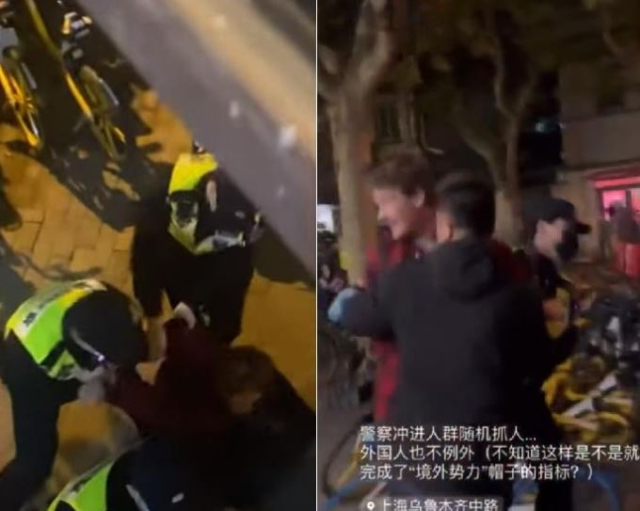 에드 로런스 BBC 기자가 27일(현지시간) 상하이에서 시위를 취재하던 중 수갑이 채워진 채 당국에 의해 연행되고 있다. 유튜브·트위터 캡처