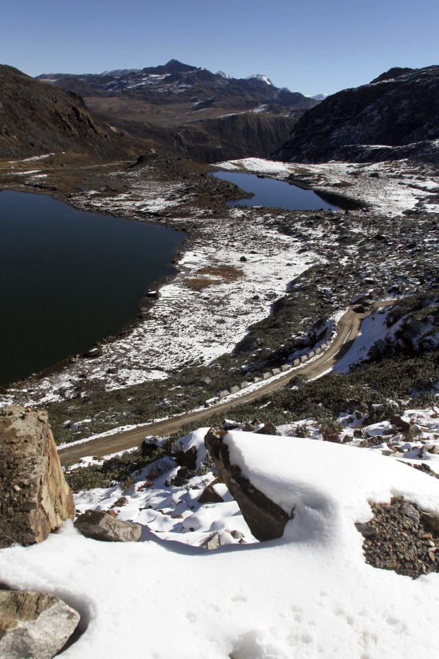 FILE- A view of the road on the way to the Line of Actual Control, at the India-China Border in Tawang, in the northeastern Indian state of Arunachal Pradesh, Monday, Oct. 30, 2006. Indian Army says its soldiers clashed with Chinese troops last week along a disputed border in India\