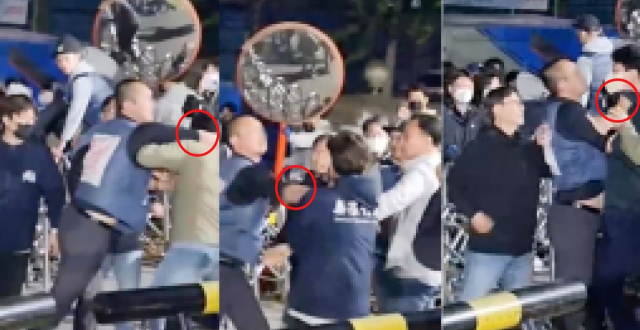 택배노조 간부 A 씨가 4월 24일 캠프 진입을 막는 쿠팡 직원을 폭행하고 있다.