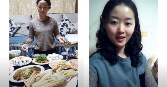 킹크랩이 올라간 밥상 등 북한 주민들이 잘 먹고 잘산다는 식의 체제 선전을 유튜브에 올린 북한 유튜버 '유미'. 올리비아 나타샤(유미) 유튜브 갈무리