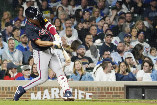 Sep 3, 2025; Chicago, Illinois, USA; Atlanta Braves shortstop Ha-Seong Kim (9) hits a three-run home run against the Chicago Cubs during the seventh inning at Wrigley Field. Mandatory Credit: David Banks-Imagn Images