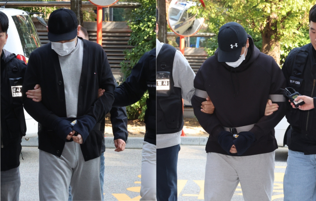 인천 아파트 지하 주차장에서 유명 유튜버를 납치하고 살해하려 한 남성 2명이 29일 인천 미추홀구 인천지방법원에서 열린 구속 전 피의자 심문(영장실질심사)에 출석하고 있다. 연합뉴스